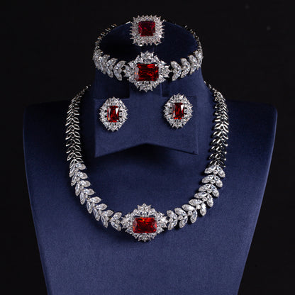 Elegant Rhodium-Plated Copper & CZ Jewelry Set with Emerald Green Zircon Accents and Leaf Motif Design