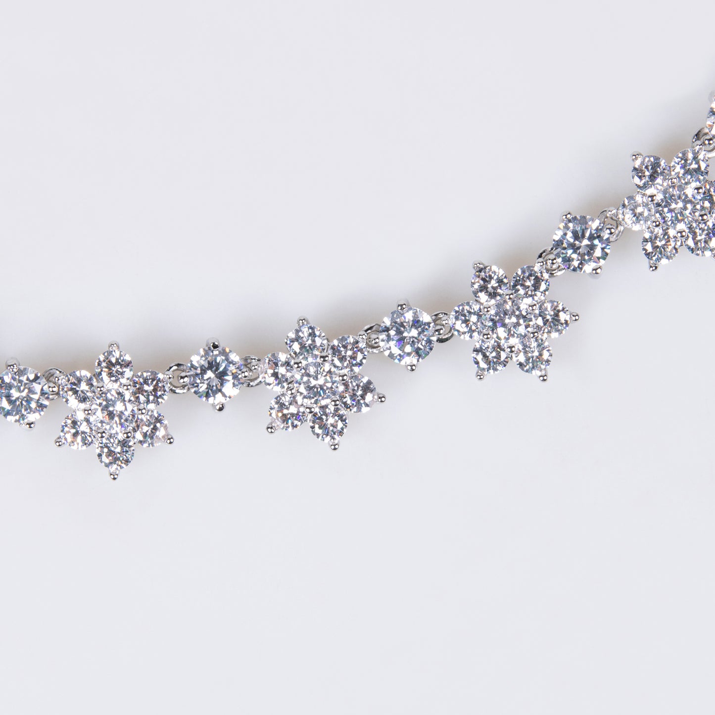 Elegant Rhodium-Plated Copper Floral Jewelry Set with Cubic Zirconia Blooms Sapphire Crystal Star Statement Necklace Stud Earrings
