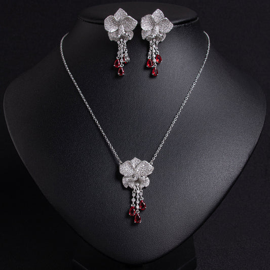 Elegant Rhodium-Plated Copper Floral Jewelry Set with Red Gemstone Accents and Micro-Pave Detailing